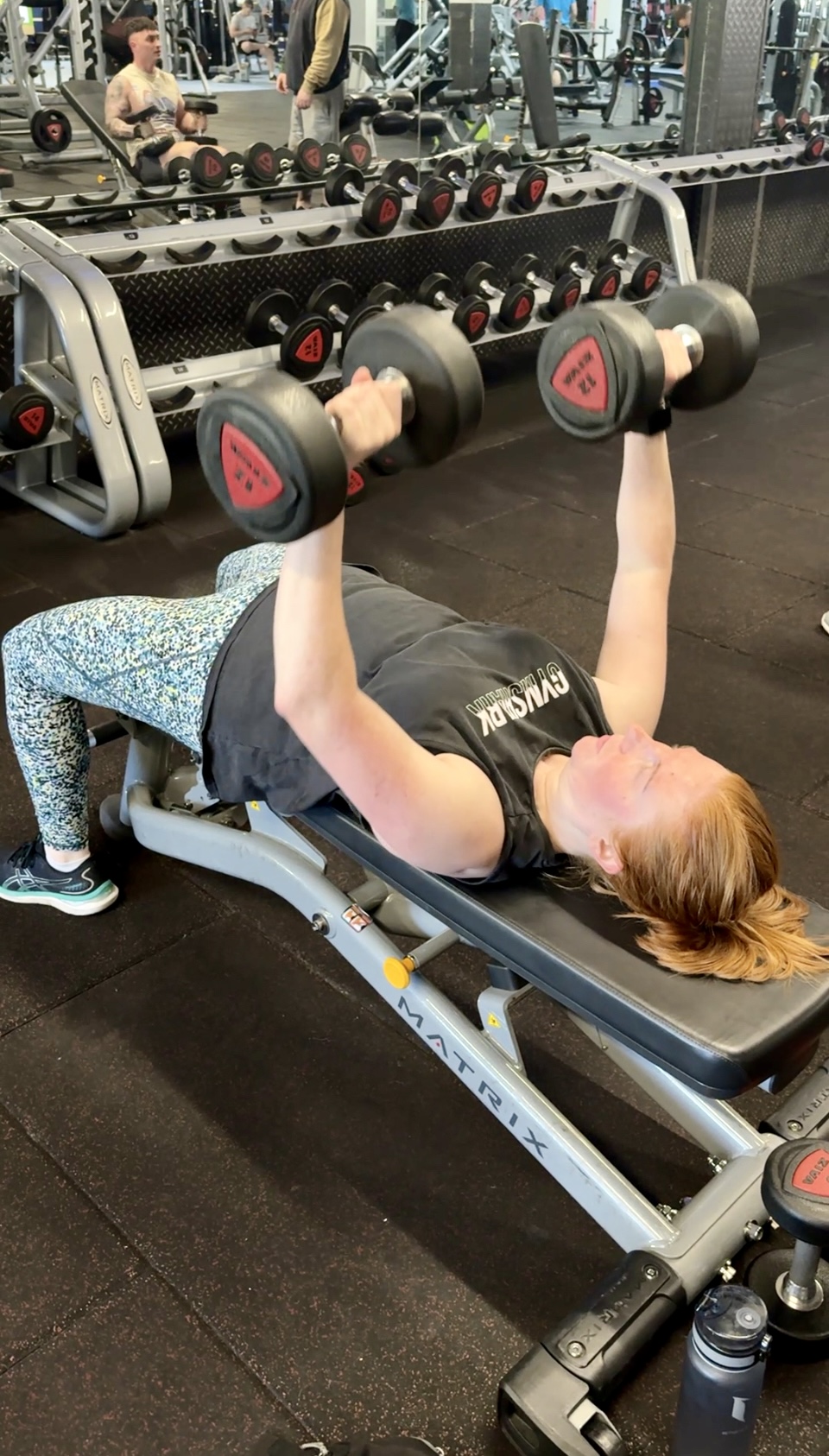 Emma coaching a client during a strength training session